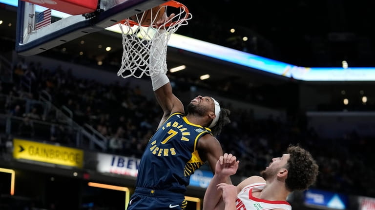 Indiana Pacers' Buddy Hield (7) dunks against Houston Rockets' Alperen...