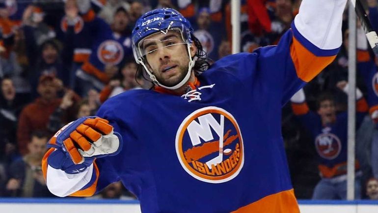 Matt Moulson of the Islanders celebrates his third-period goal against the...