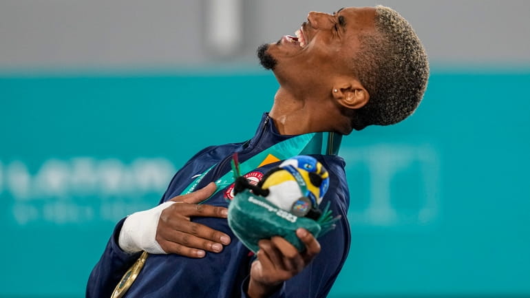 Carl Nickolas of the United States sings the national anthem...