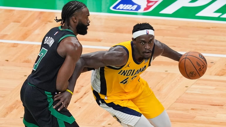 Indiana Pacers forward Pascal Siakam, right, is defended by Boston...