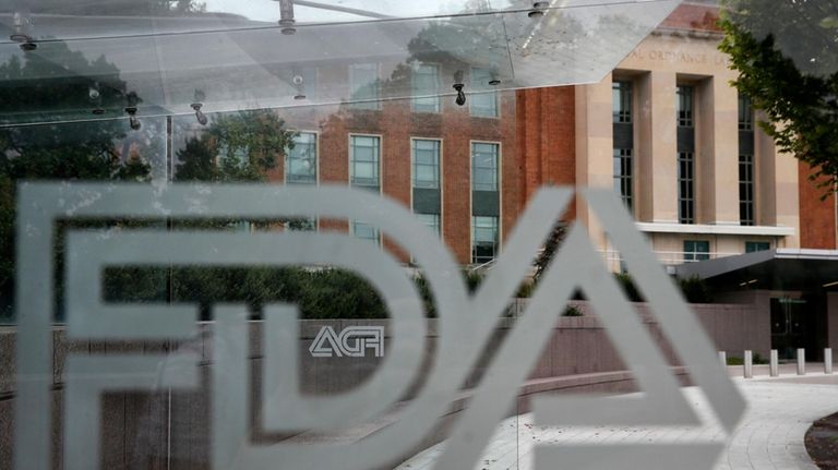 A U.S. Food and Drug Administration building is seen behind...