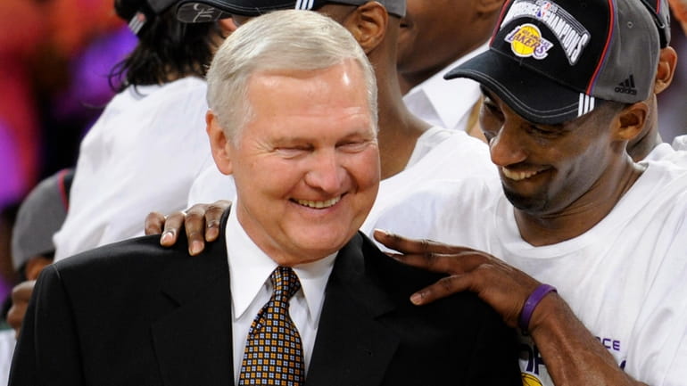 Los Angeles Lakers' Kobe Bryant gives basketball great Jerry West...