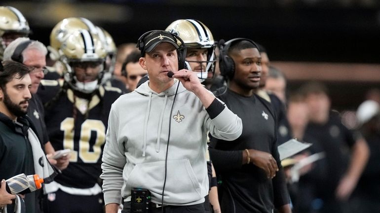 New Orleans Saints head coach Dennis Allen walks on the...