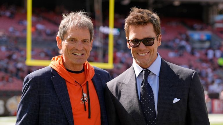 Former NFL players Bernie Kosar, left, and Tom Brady, right,...