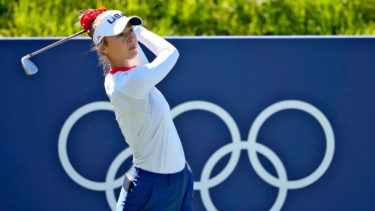 Nelly Korda, of the United States, hits from the eighth...