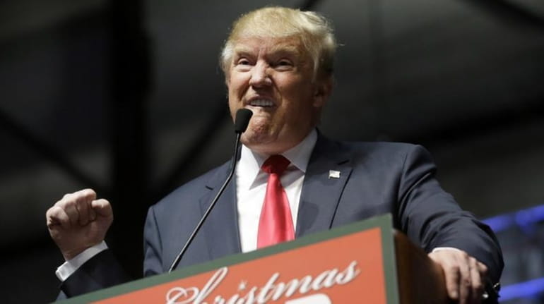 Republican presidential candidate Donald Trump addresses supporters at a campaign...