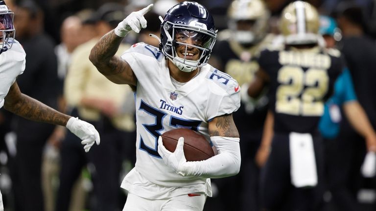 Tennessee Titans safety Amani Hooker celebrates an interception against the...