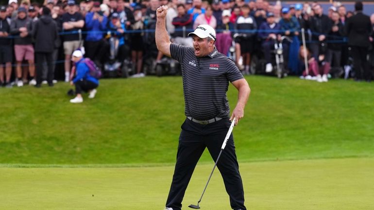 Ryan Fox of New Zealand celebrates his putt on the...