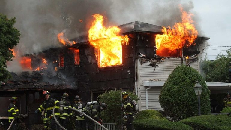 Firefighters from Point Lookout-Lido, Long Beach and Freeport battle an...