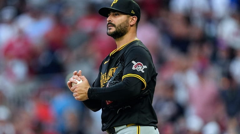 Pittsburgh Pirates starting pitcher Martin Perez paces on the mound...