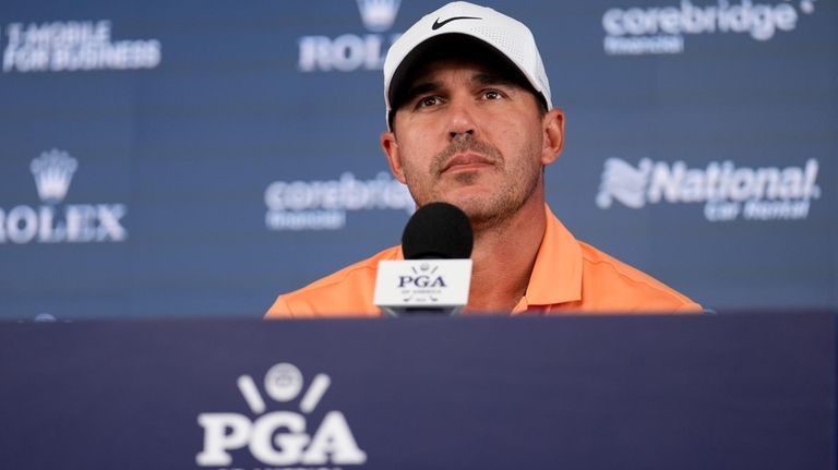 Brooks Koepka speaks during a news conference at the PGA...