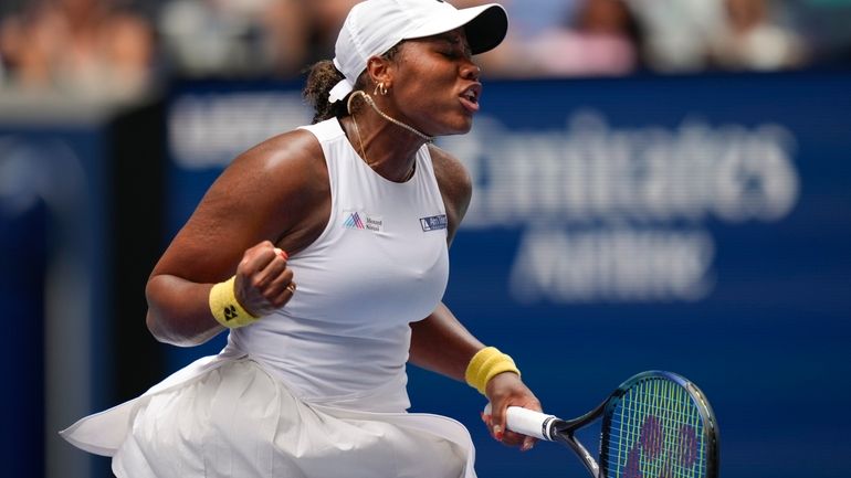 Taylor Townsend, of the United States, reacts after scoring a...