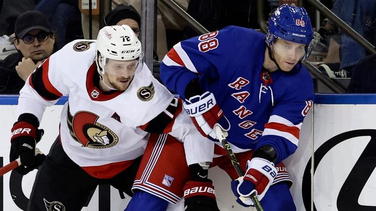 Patrick Kane of the Rangers plays the puck during the second period...