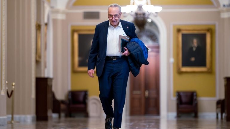 Senate Majority Leader Chuck Schumer, D-N.Y., arrives as the Senate...