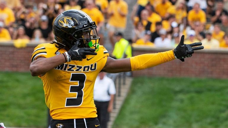 Missouri wide receiver Luther Burden III celebrates a first down...