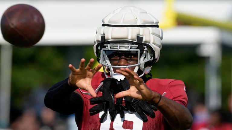 Arizona Cardinals wide receiver Marvin Harrison Jr. makes a catch...