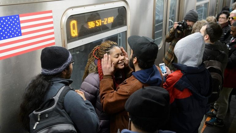 Harlem residents on the first day of service to the...