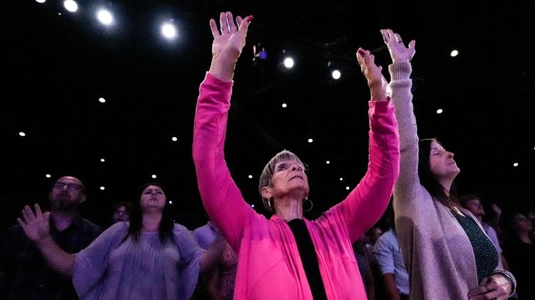 A member prays during a Sunday service at Bethlehem Church,...