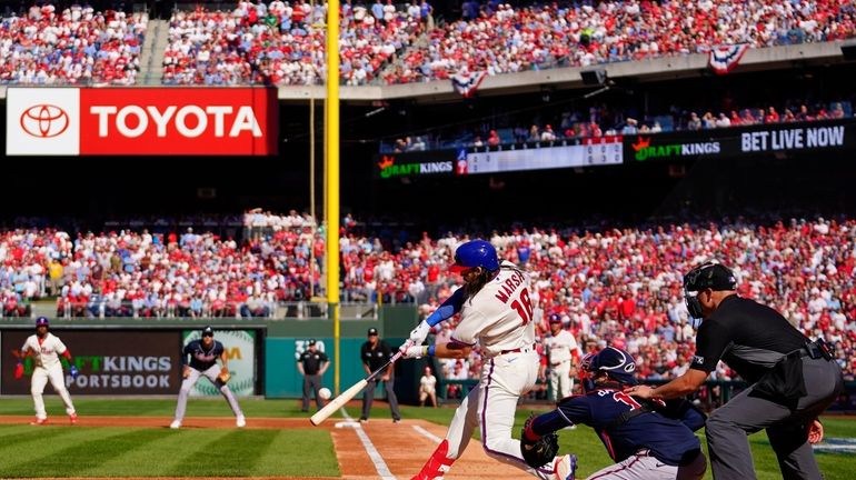 Philadelphia Phillies Brandon Marsh (16) hits a three-run homer during...