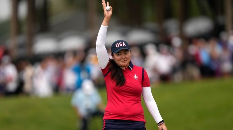 United States' Allisen Corpuz celebrates on the 16th green after...