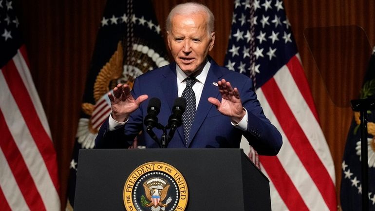 President Joe Biden speaks at an event commemorating the 60th...