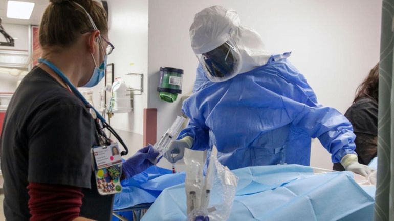 Nurse Jennifer Caspary and emergency department medical director Dr. Leroy...