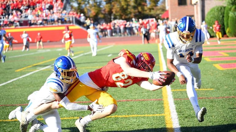 Patrick Bruno of Chaminade scores the winning touchdown despite the...