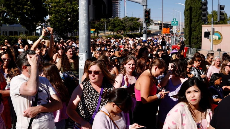 Fans wait to go through security before Taylor Swift performs...