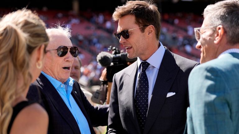 Dallas Cowboys team owner Jerry Jones, left, and analyst Tom...