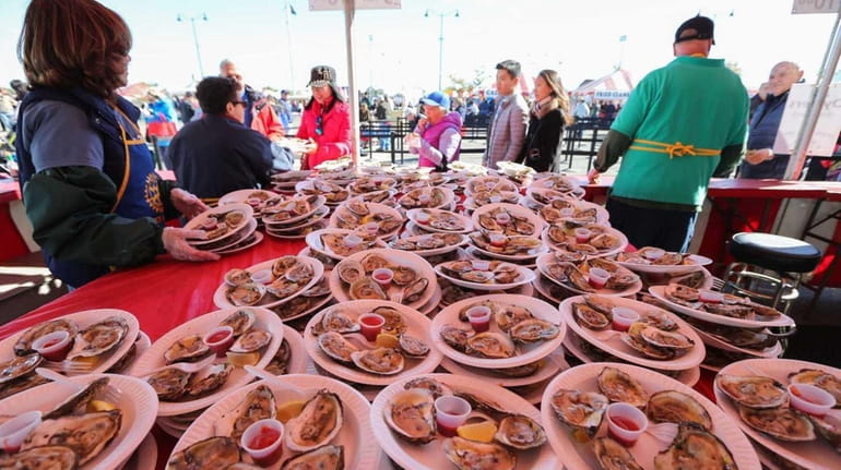 Oysters plated for sale during the 2015 Oyster Festival at...