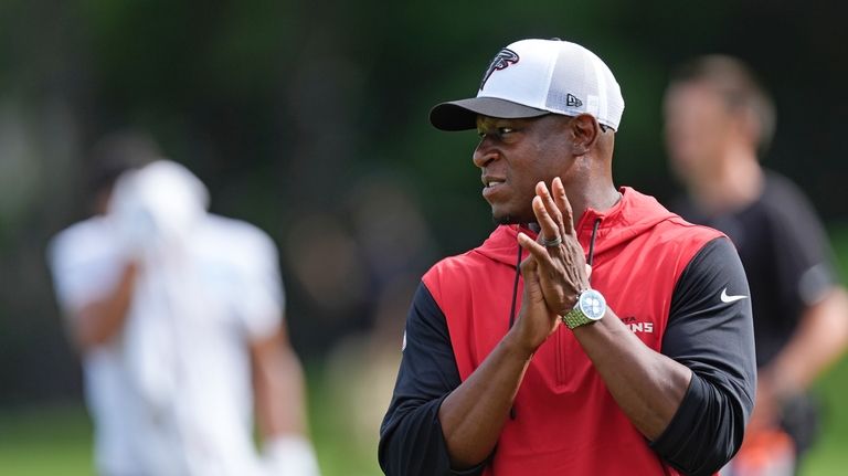 Atlanta Falcons head coach Raheem Morris watches an NFL training...