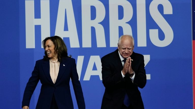 Democratic presidential nominee Vice President Kamala Harris and her running...