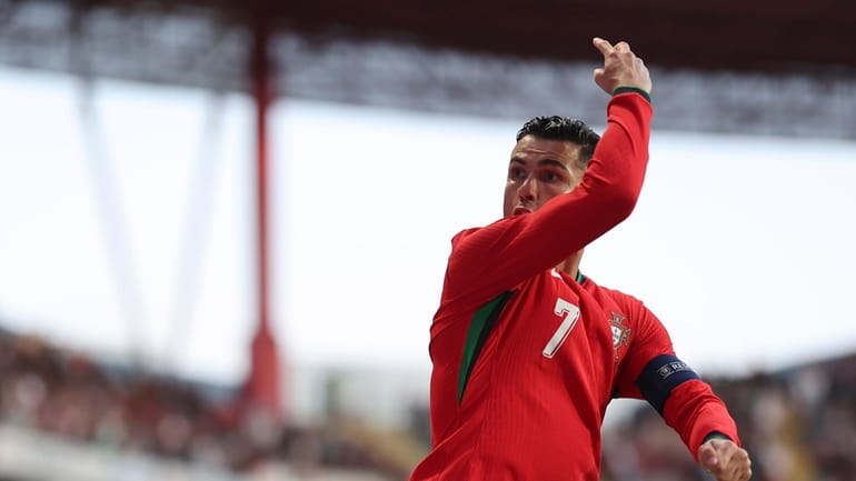 Portugal's Cristiano Ronaldo celebrates after scoring against Ireland during a...