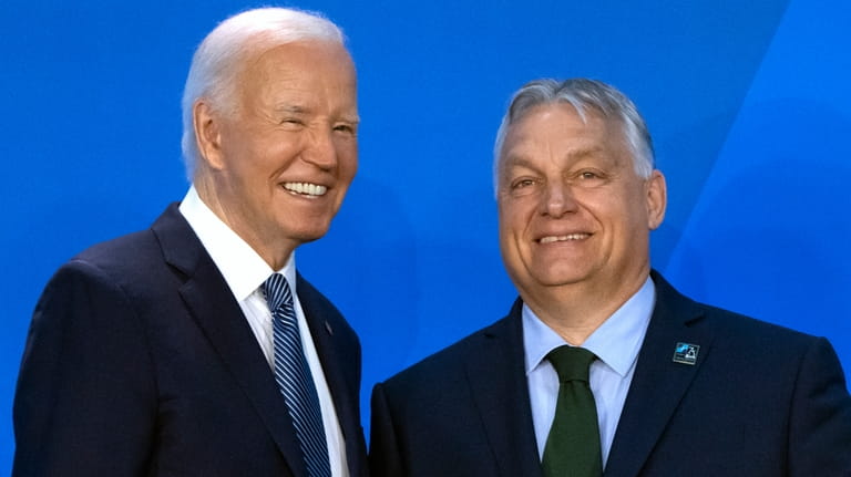 President Joe Biden, left, greets Viktor Orban, Prime Minister of...