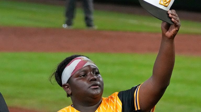 Lake Mary, Fla.'s Teraj Alexander waves to fans as he...