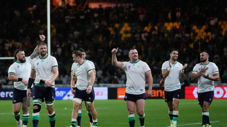 Ireland players gesture to supporters following the Rugby World Cup...