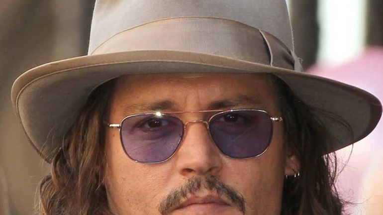 Johnny Depp's signature sunglasses with blue lenses