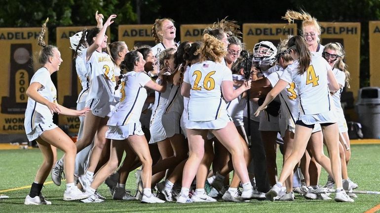 Massapequa celebrates its Nassau Class A girls lacrosse final victory...