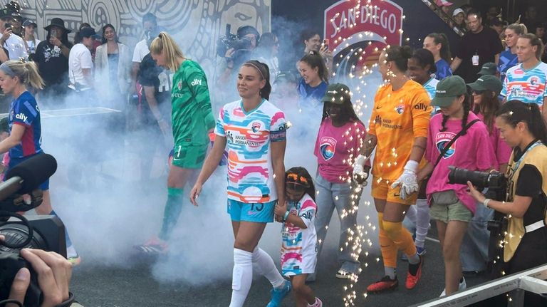 San Diego Wave's Alex Morgan takes to the field before...