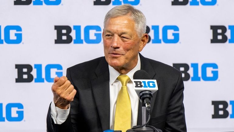 Iowa head coach Kirk Ferentz talks with reporters during an...