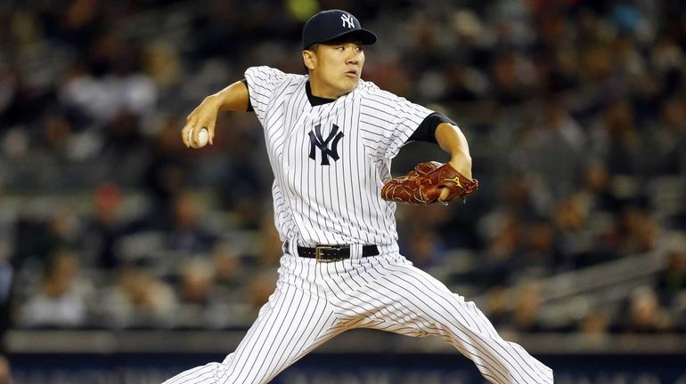 Masahiro Tanaka pitches in the first inning against the Los...