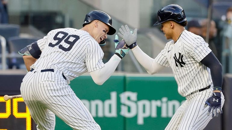 Juan Soto of the Yankees celebrates his first-inning two-run home...