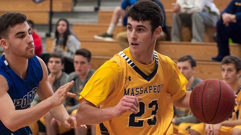 Massaepequa's Dylan Nealis (23, right) with Port Washington's Jake Block...