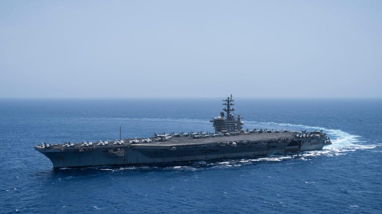 The USS aircraft carrier Dwight D. Eisenhower, also known as...