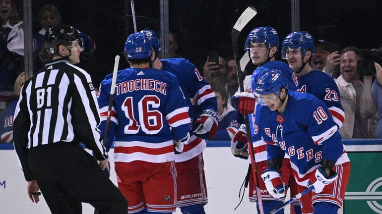 Rangers players celebrate a goal by left wing Artemi Panarin,...
