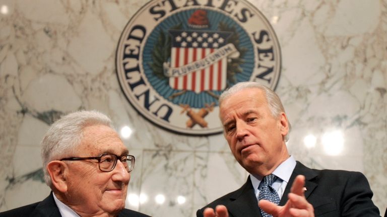 Former Secretary of State Henry Kissinger, left, talks with Senate...