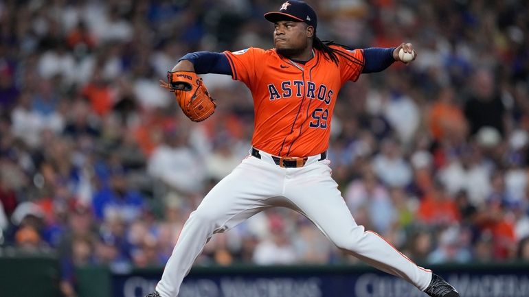 Houston Astros starting pitcher Framber Valdez delivers during the first...