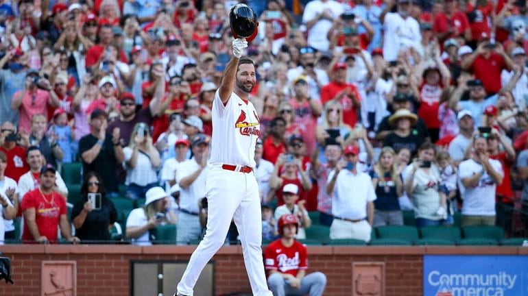 St. Louis Cardinals' Tyler O'Neill is tagged out at home by Atlanta Braves  catcher Sean Murphy during the seventh inning of a baseball game Tuesday,  April 4, 2023, in St. Louis. (AP