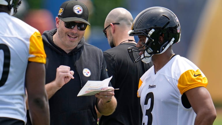 Pittsburgh Steelers offensive coordinator Arthur Smith, second from left, gives...