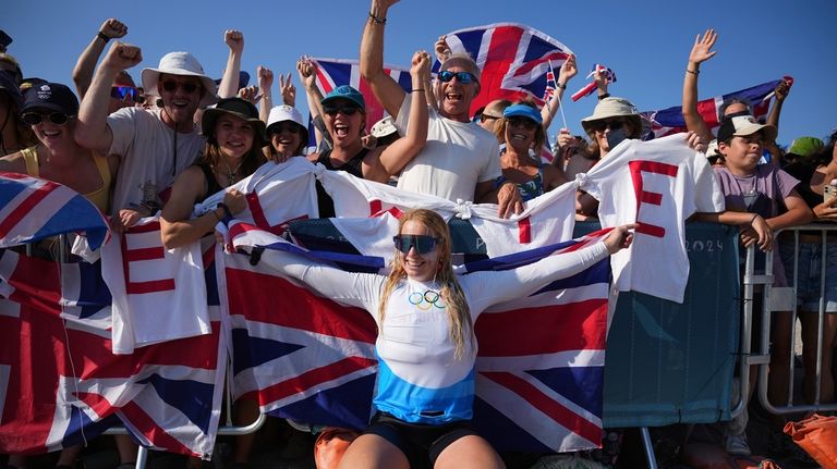 Ellie Aldridge of Britain celebrates after winning the women's kite...